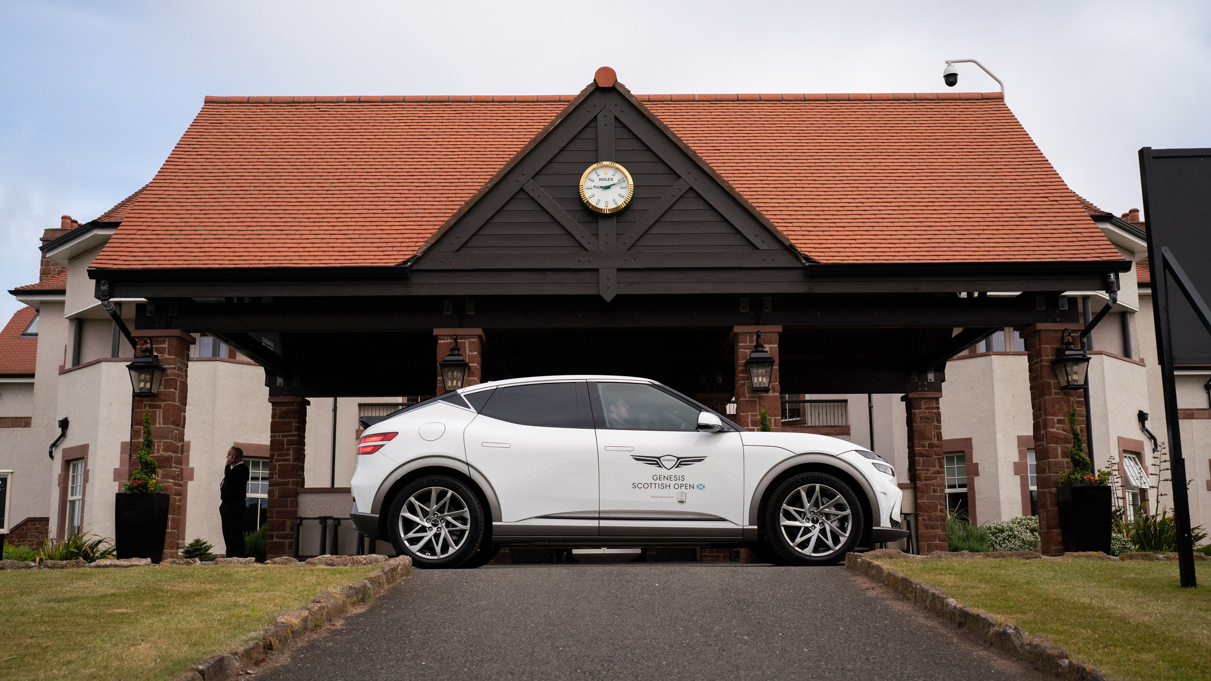 White GV60 in front of a building at the Genesis Scottish Open 2024 