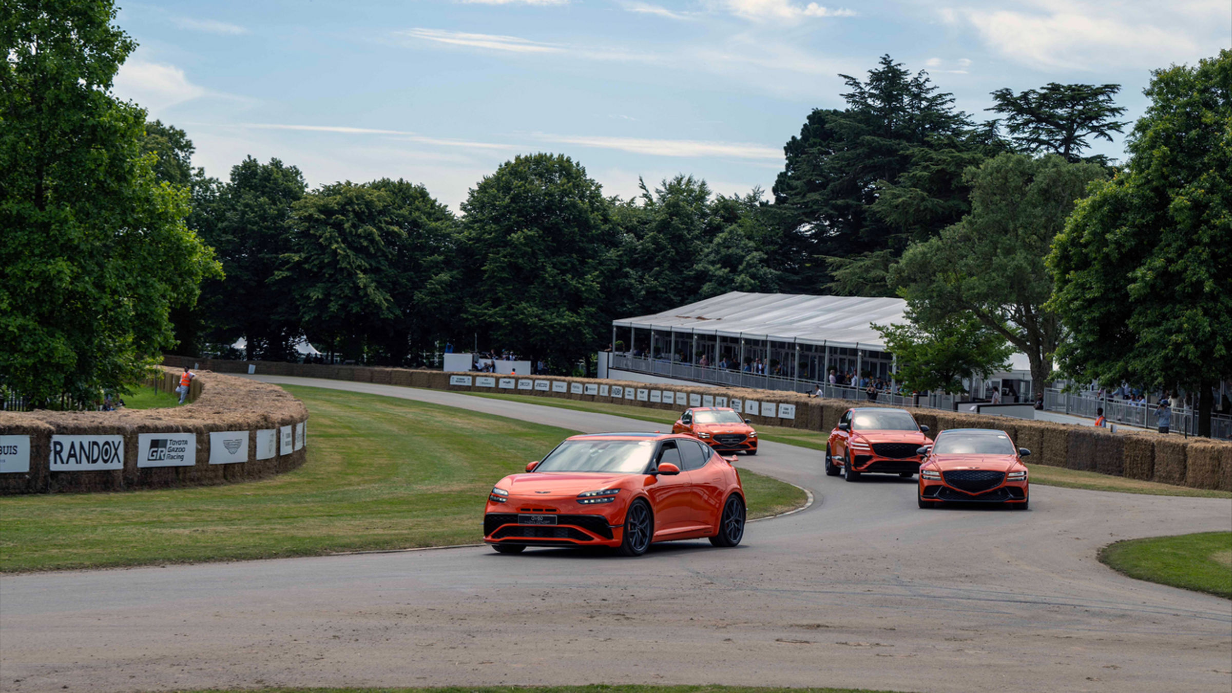 Genesis Magma Line cars driving on the racetrack of the Goodwood Festival of Speed