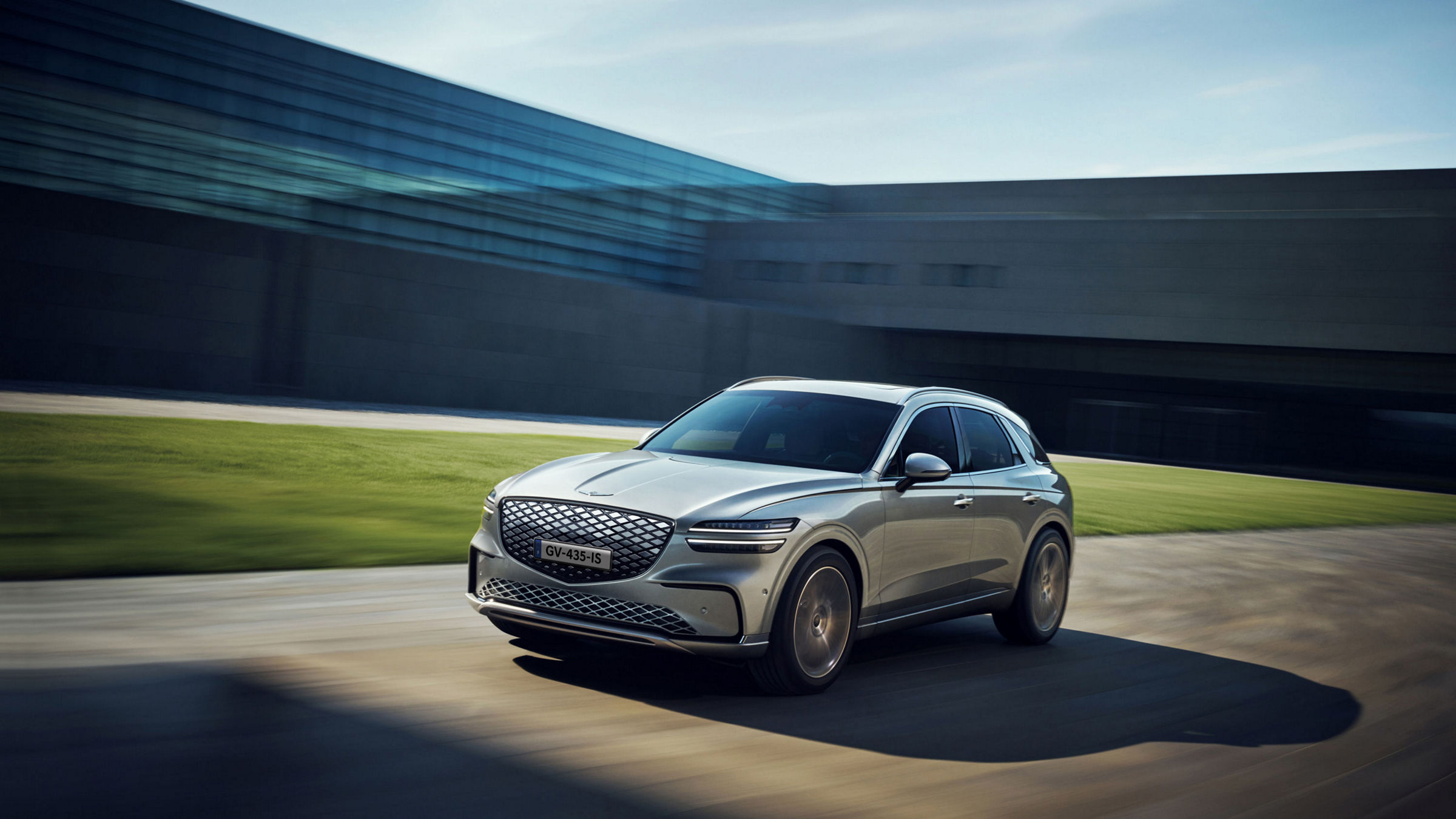 Genesis Electrified GV70 driving on the road.