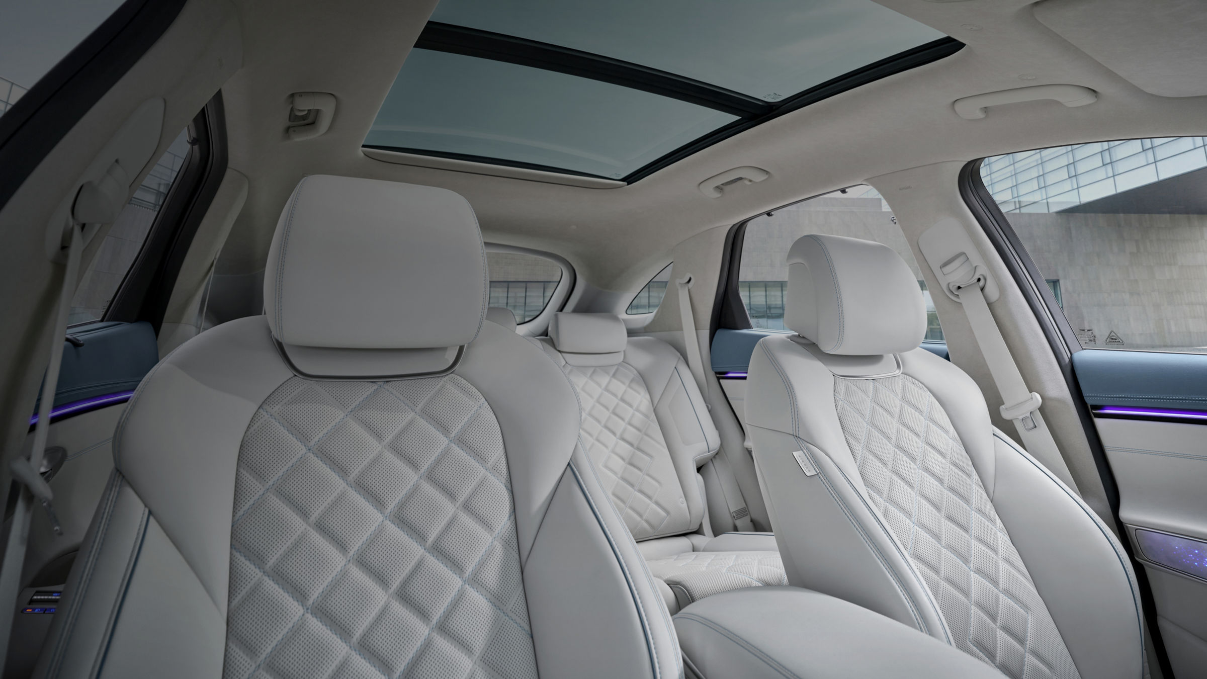 A view of the driver and front passenger seats, both with leather upholstery.