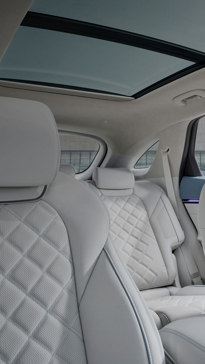 A view of the driver and front passenger seats, both with leather upholstery.