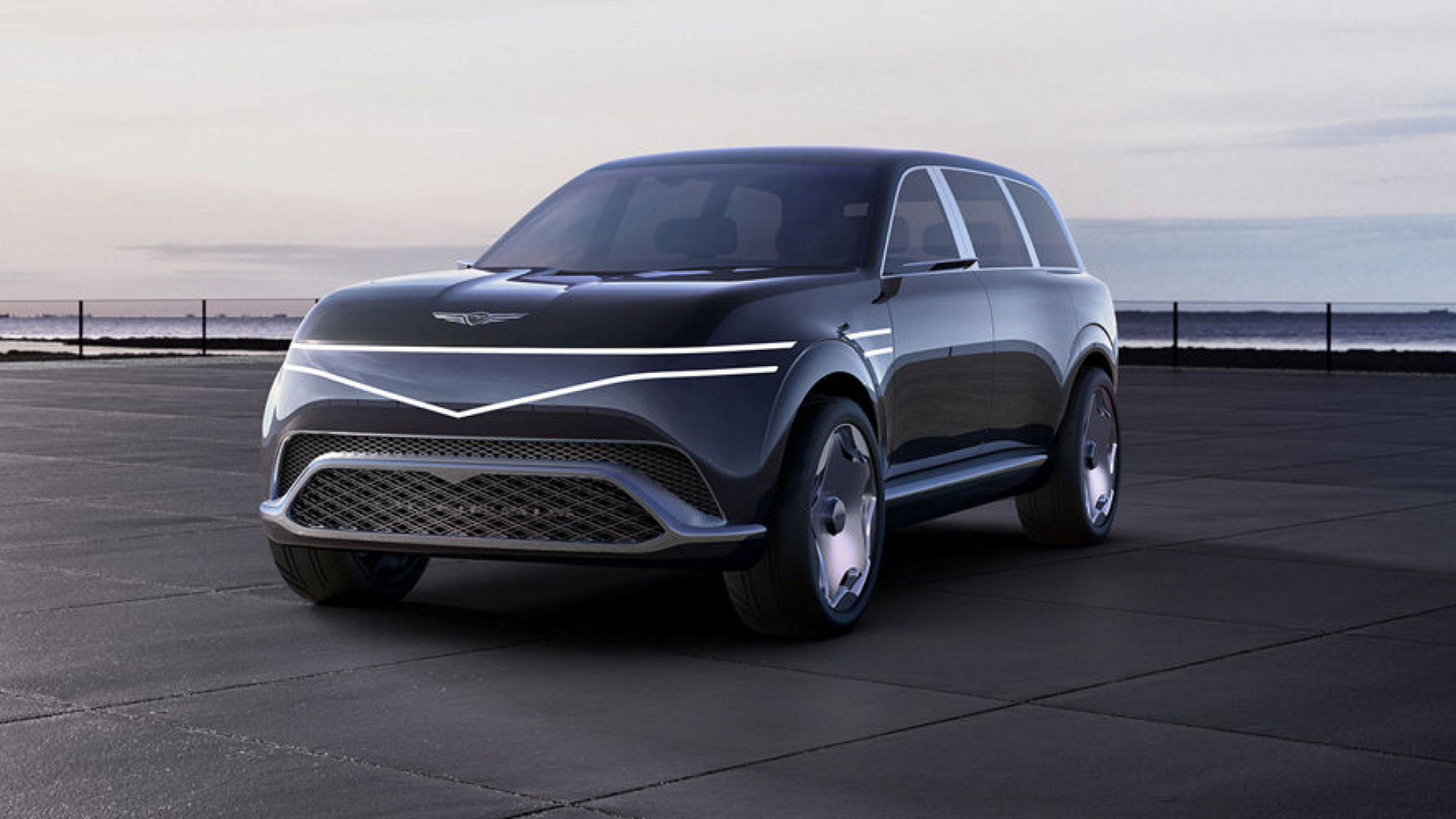 Genesis Neolun Concept SUV in front of the coast exterior front view"