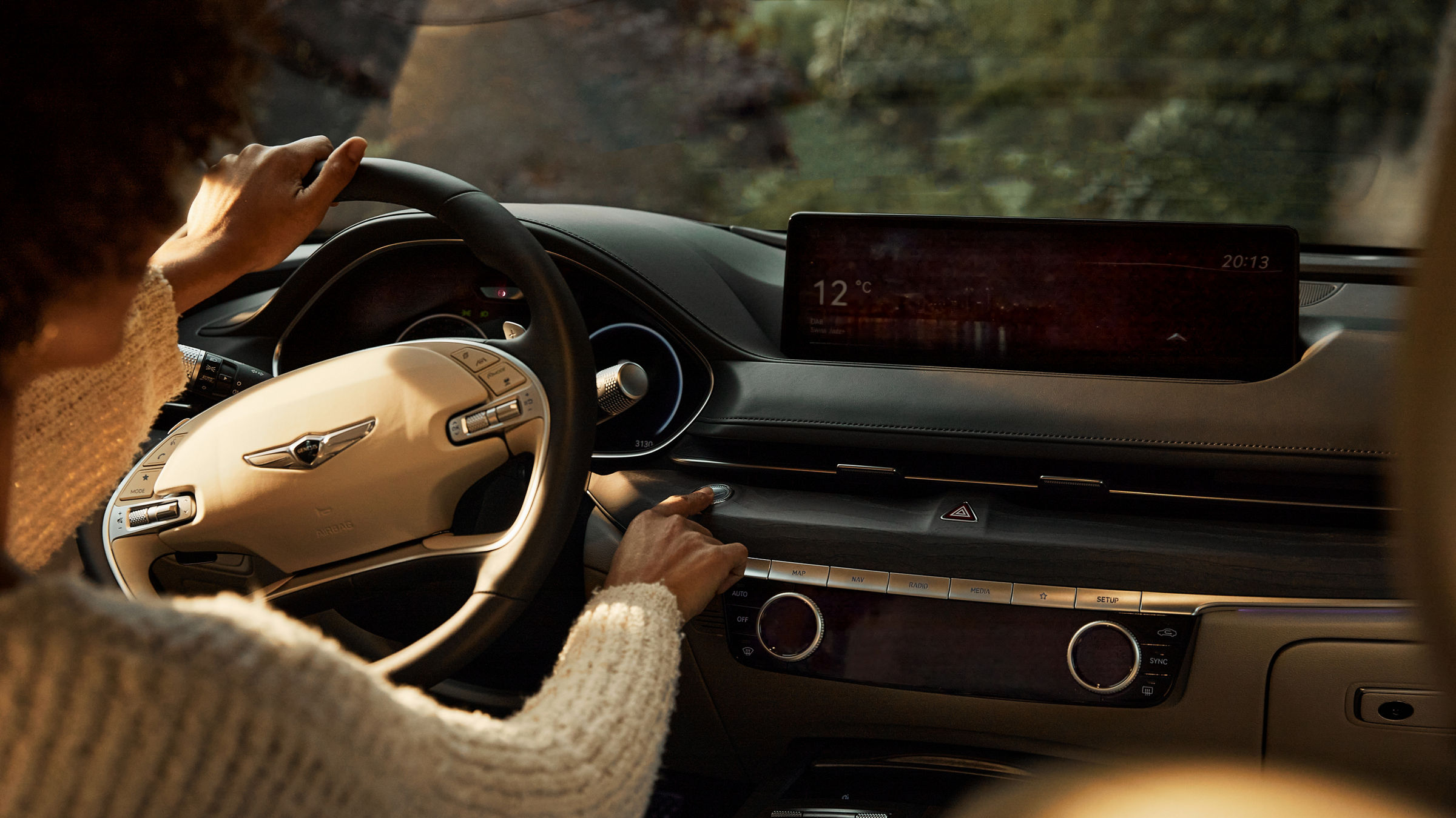 Looking over the shoulder of a person at the wheel of a car