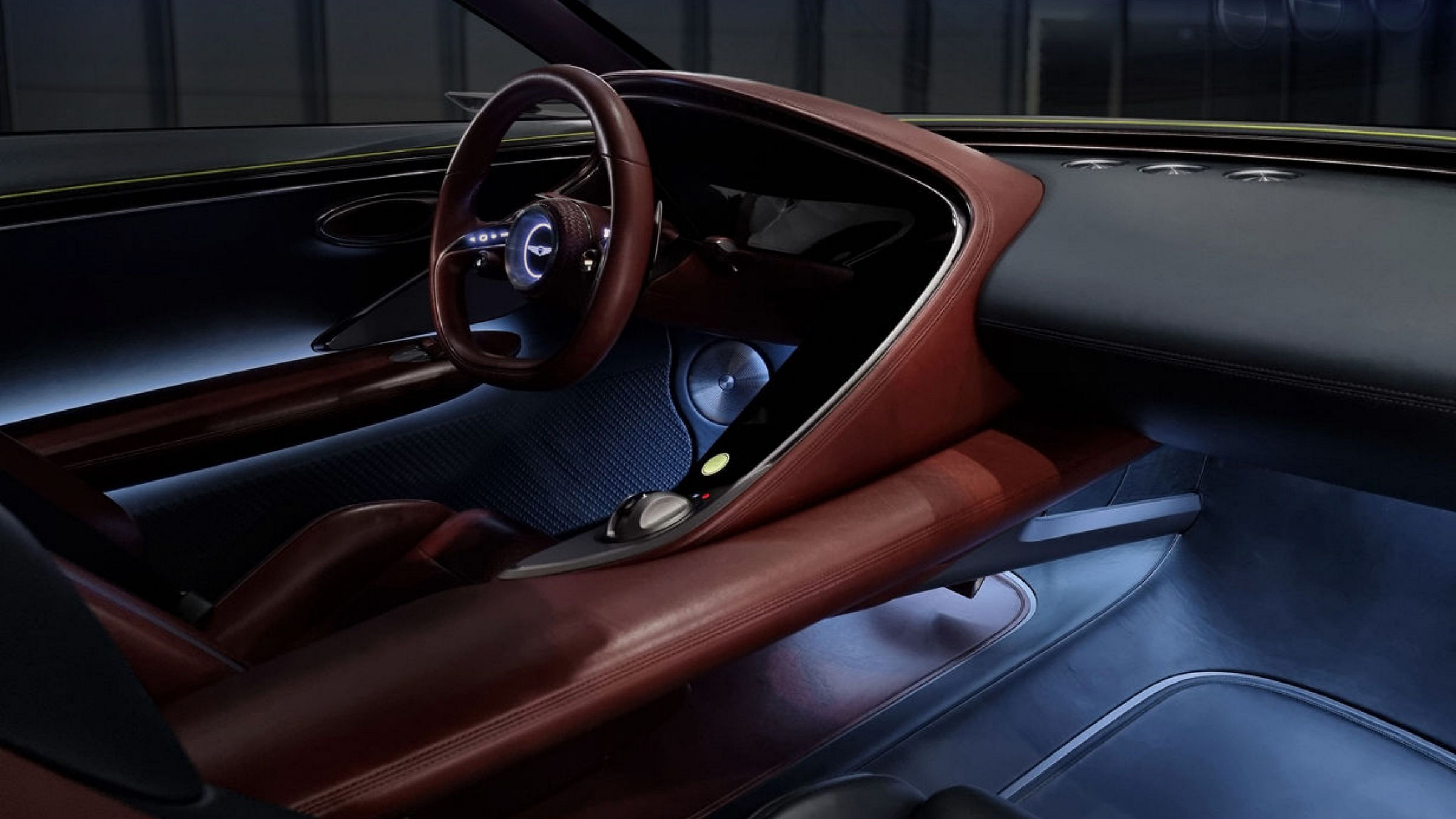 Detail of the steering wheel and dashboard in brown black from the Genesis X Concept