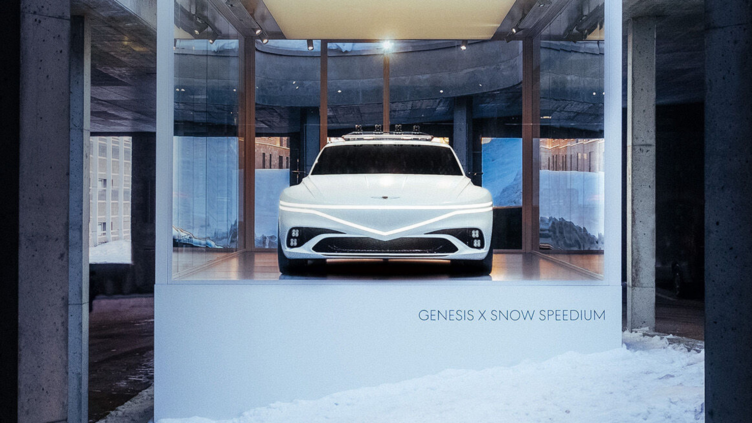 Genesis X Snow Speedium concept car displayed in a glass showroom