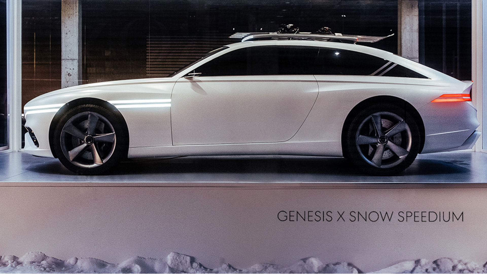 Genesis X Snow Speedium concept car is parked on top of a white pedestal.