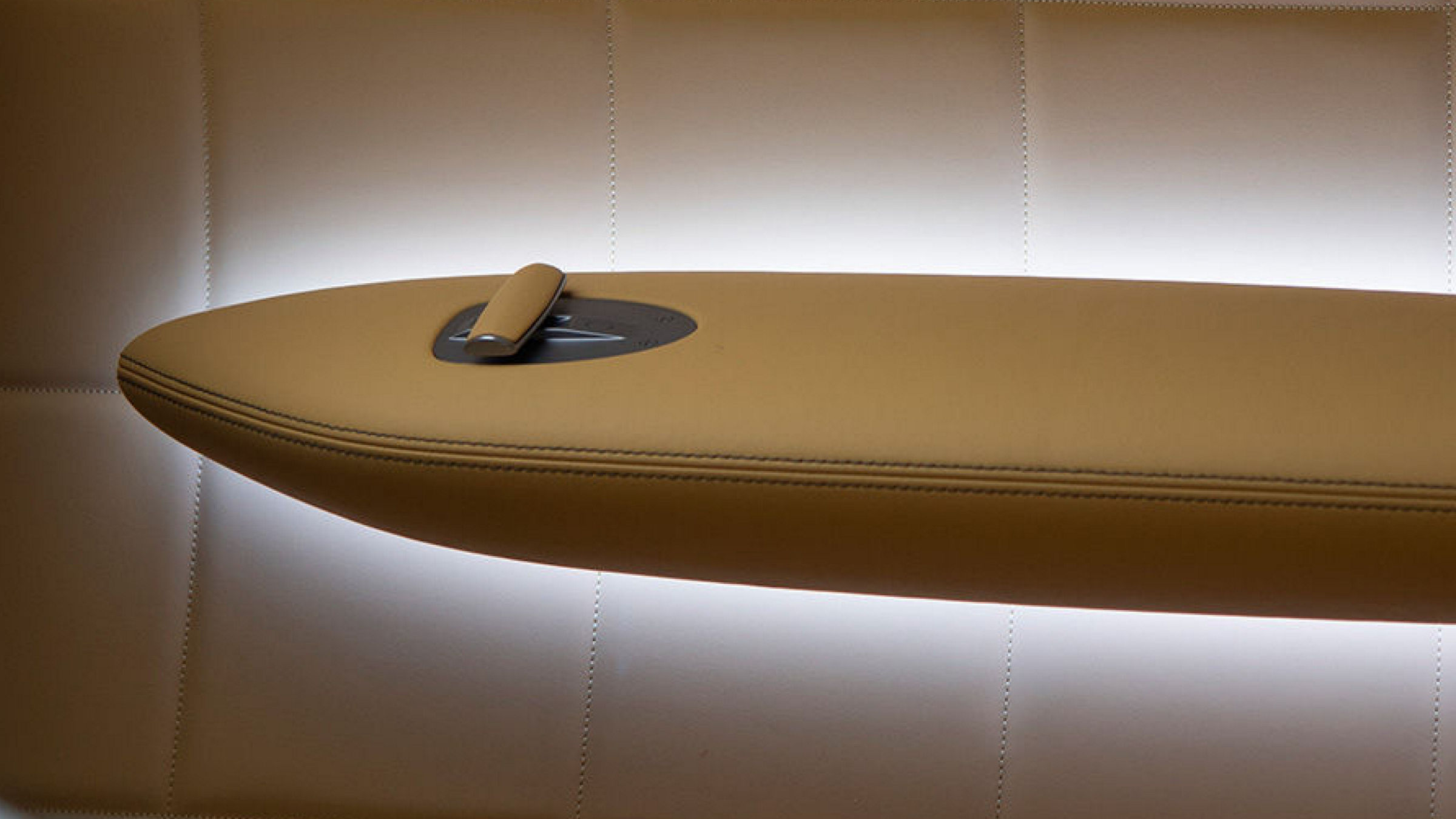 Detail view of the Genesis X Speedium Concept interior armrest, showcasing its sleek and luxurious design