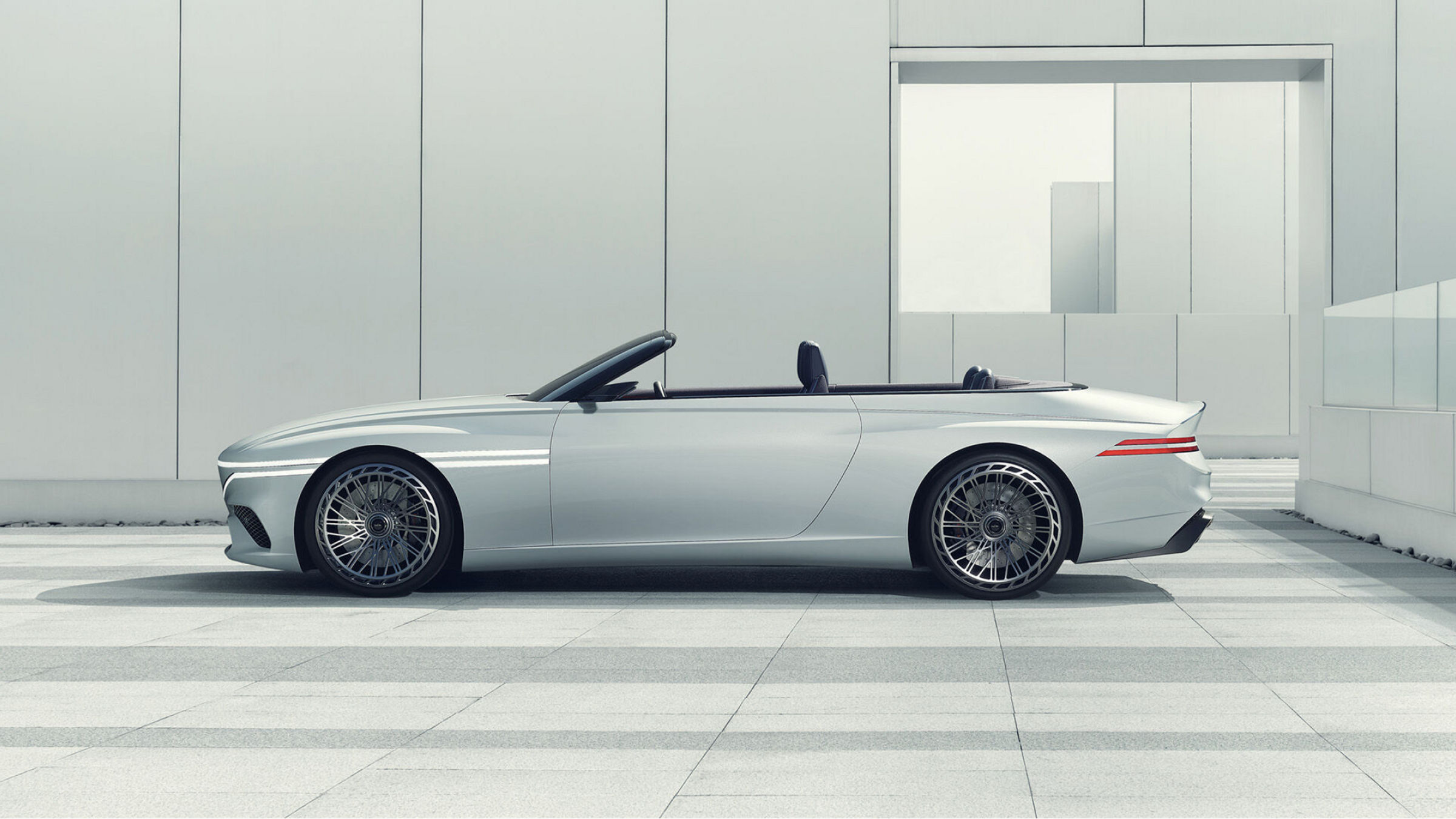 Genesis X Convertible in white from the side in a white room