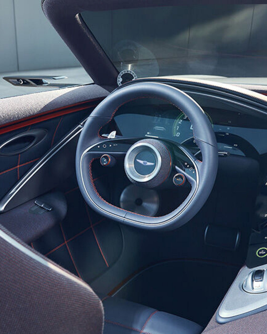 Driver's seat and steering wheel from the Genesis X Convertible with brown-black interior