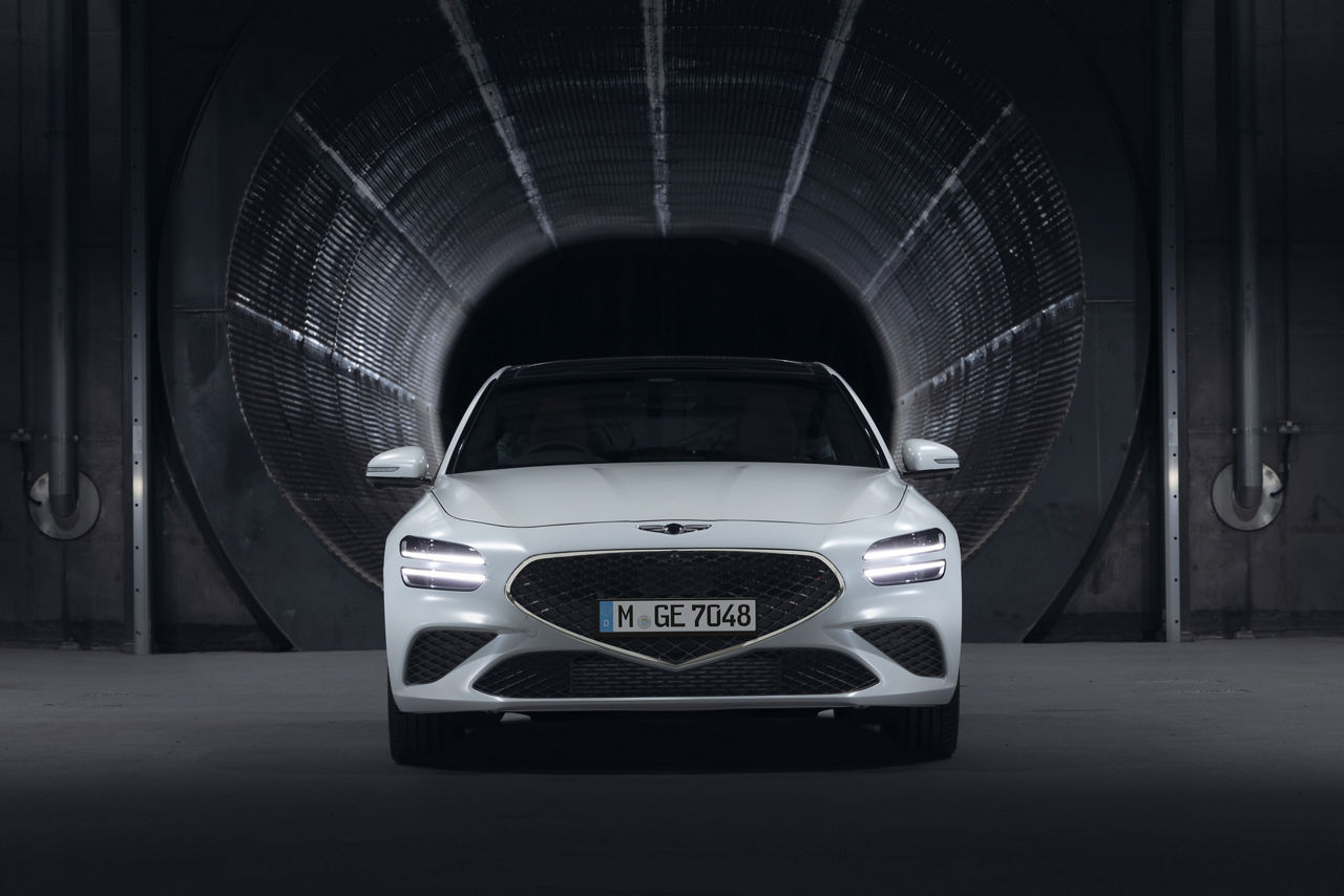 Genesis G70 Shooting Brake white frontview in front of a garage