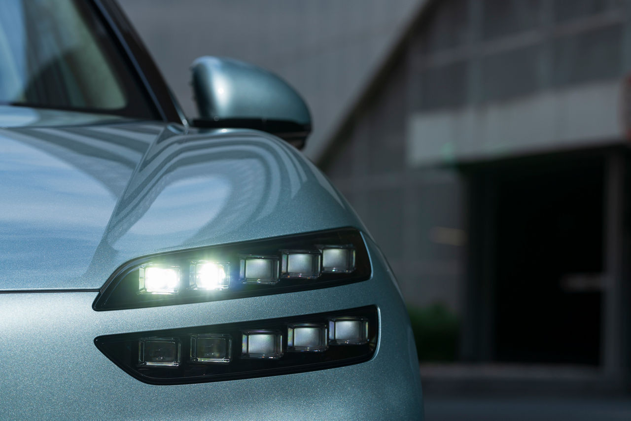 Detailed view of the headlight of a mint Genesis GV60