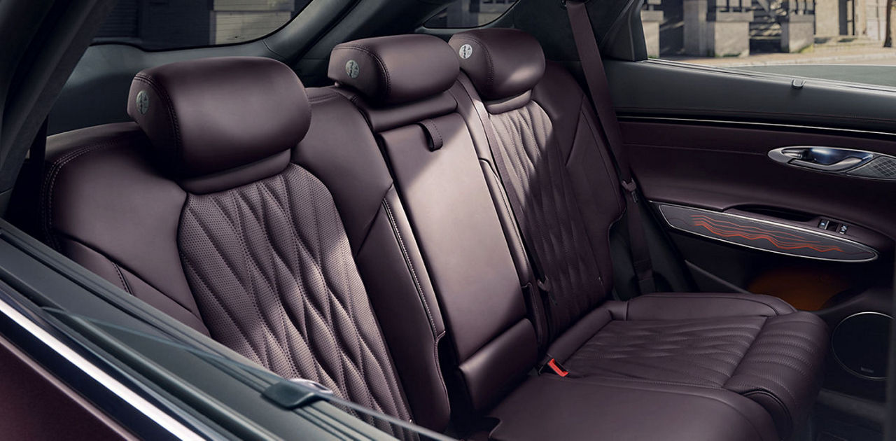 Rear seats of a car in dark red colour