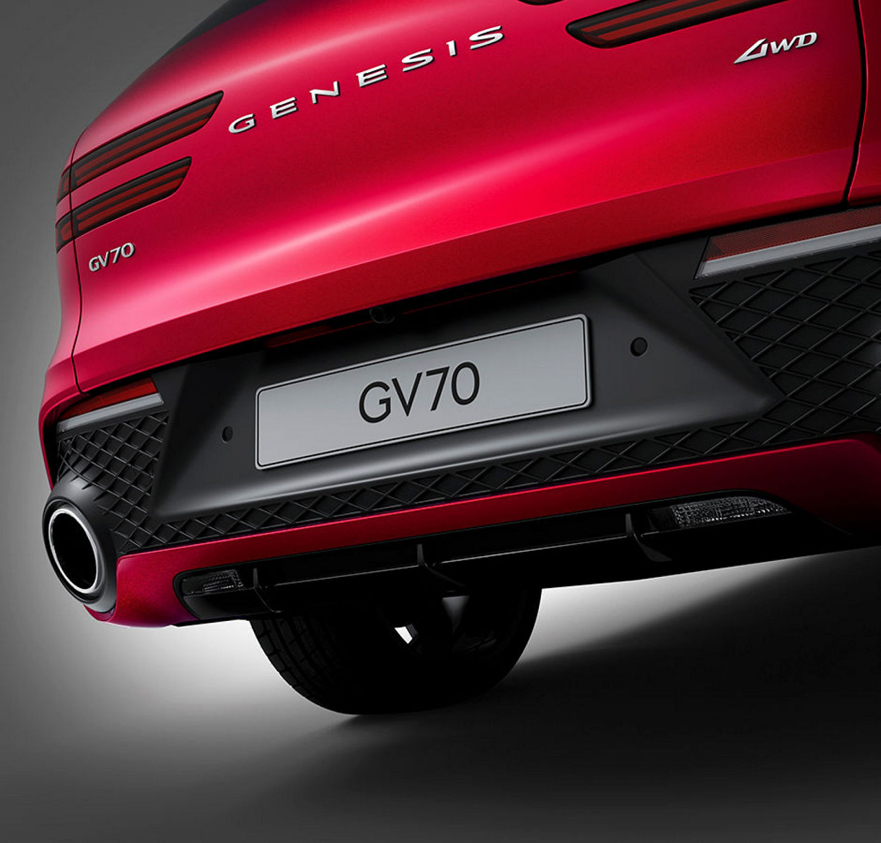 Exhaust details of a red Genesis GV70