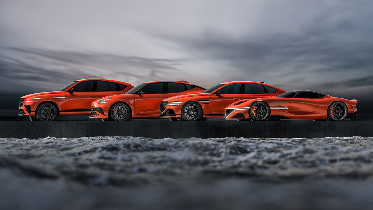 Four orange Genesis Magma Concept cars side by side - side view outdoors