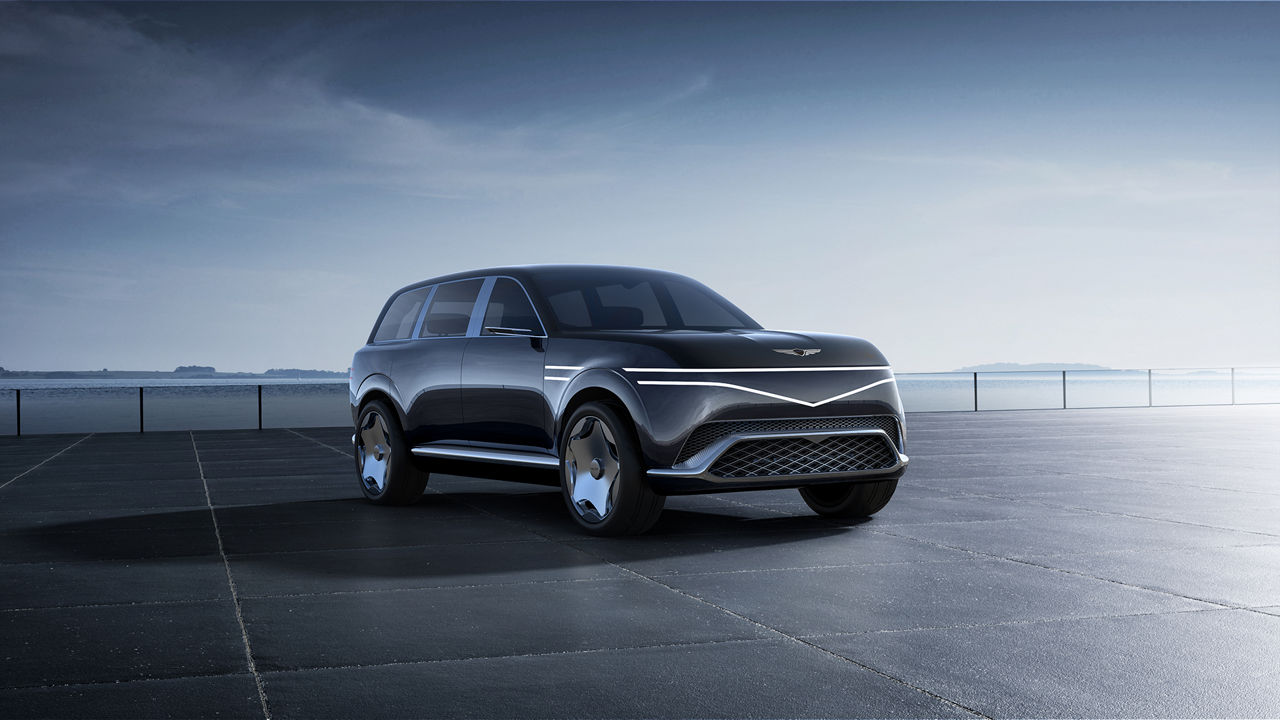 Black Genesis Neolun Concept SUV from the front with the sea in the background