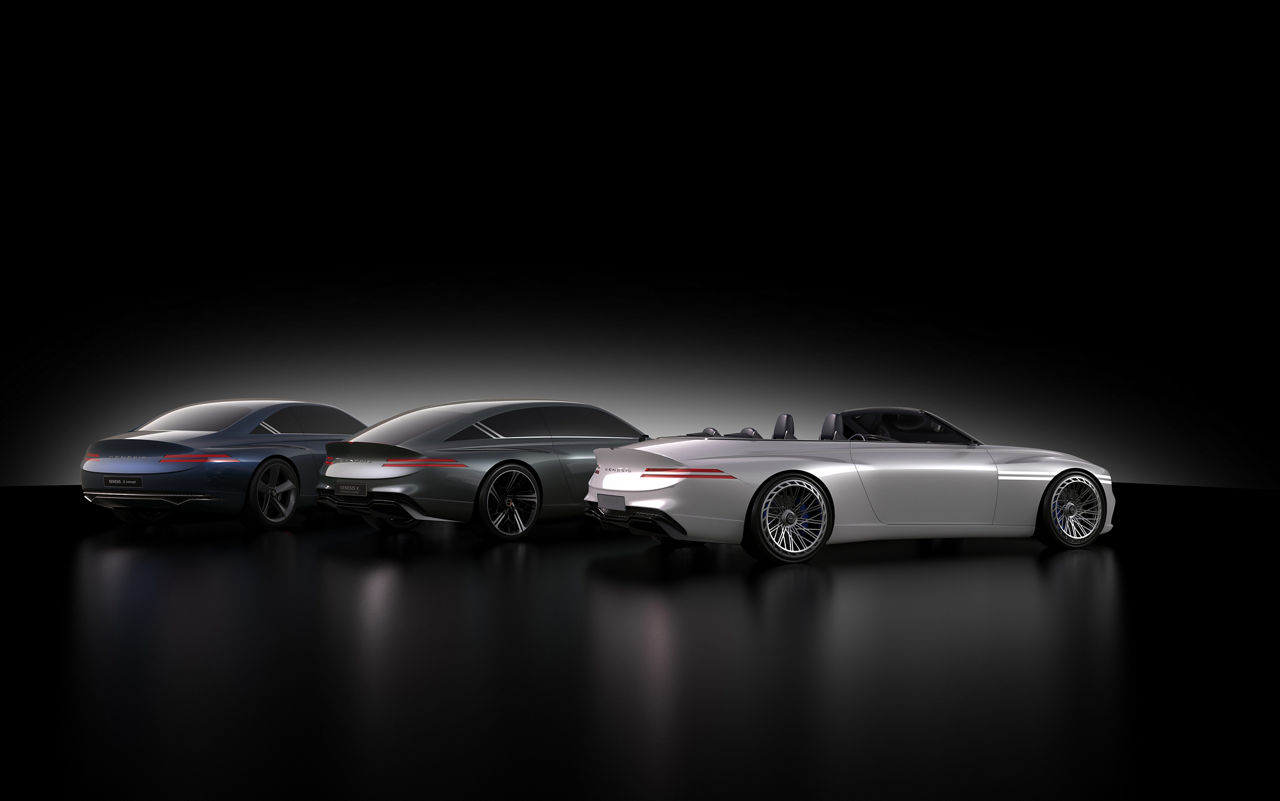 Three variants of the Genesis X Concept side by side from diagonally behind