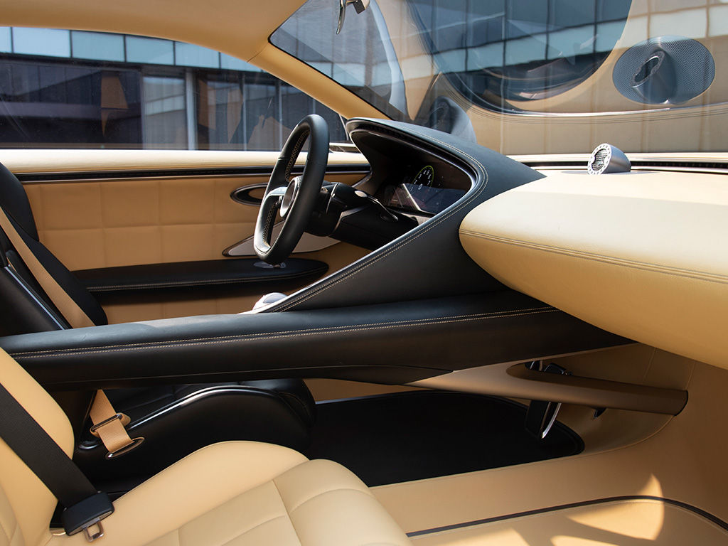 Front interior of the Genesis X Spedium Coupe in brown from the passenger's perspective