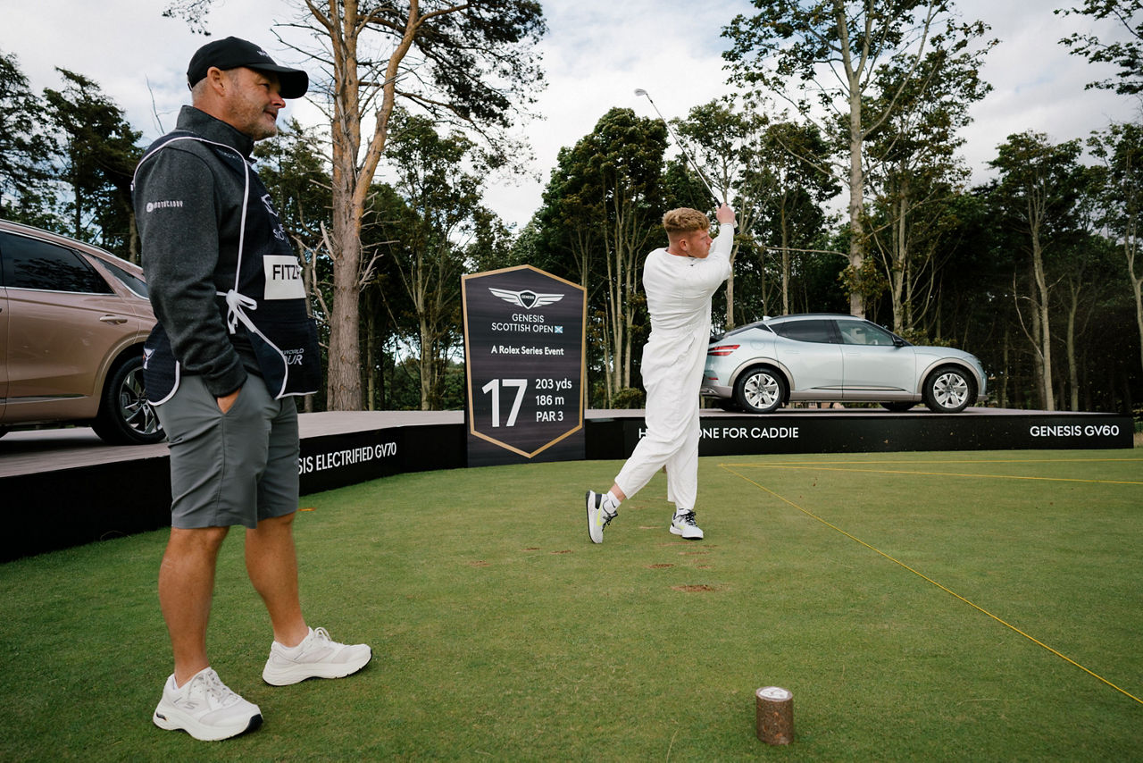 Golf player hits a golf ball at the Scottish open