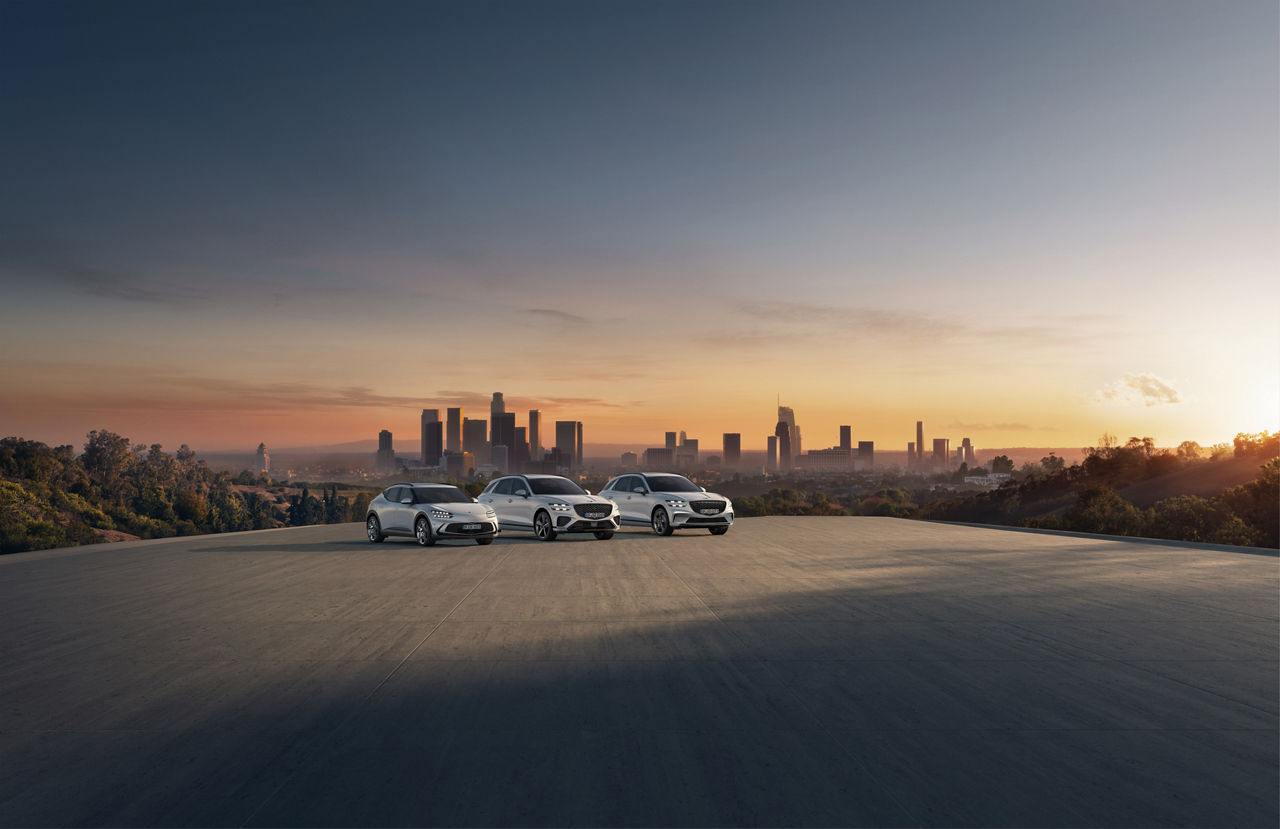 Grey Genesis GV70, Electified GV70 and GV60 in front of a city skyline