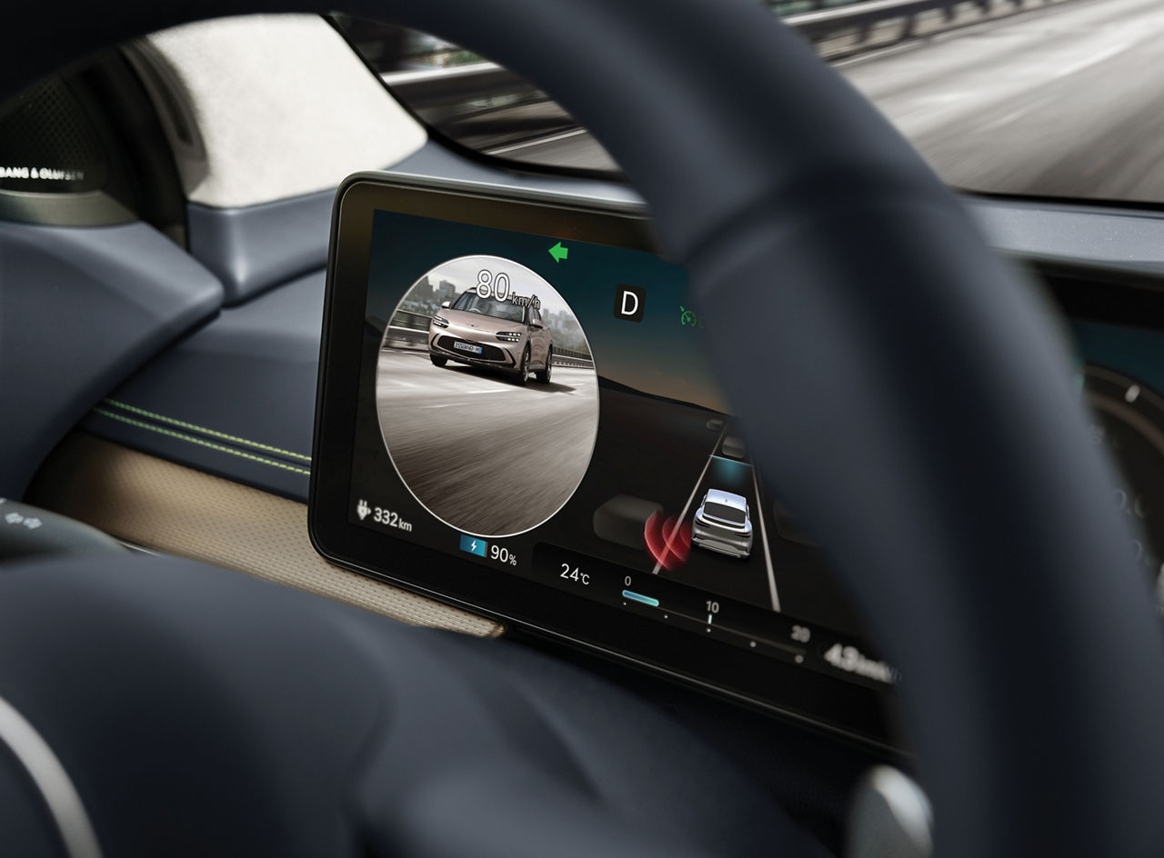 Dashboard of the Genesis GV60 shows a car in the blind spot