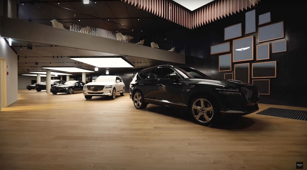 Genesis indoor studio with some vehicles