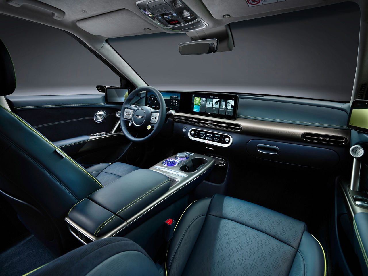 Front interior of the Genesis GV60 with green-blue interior trim