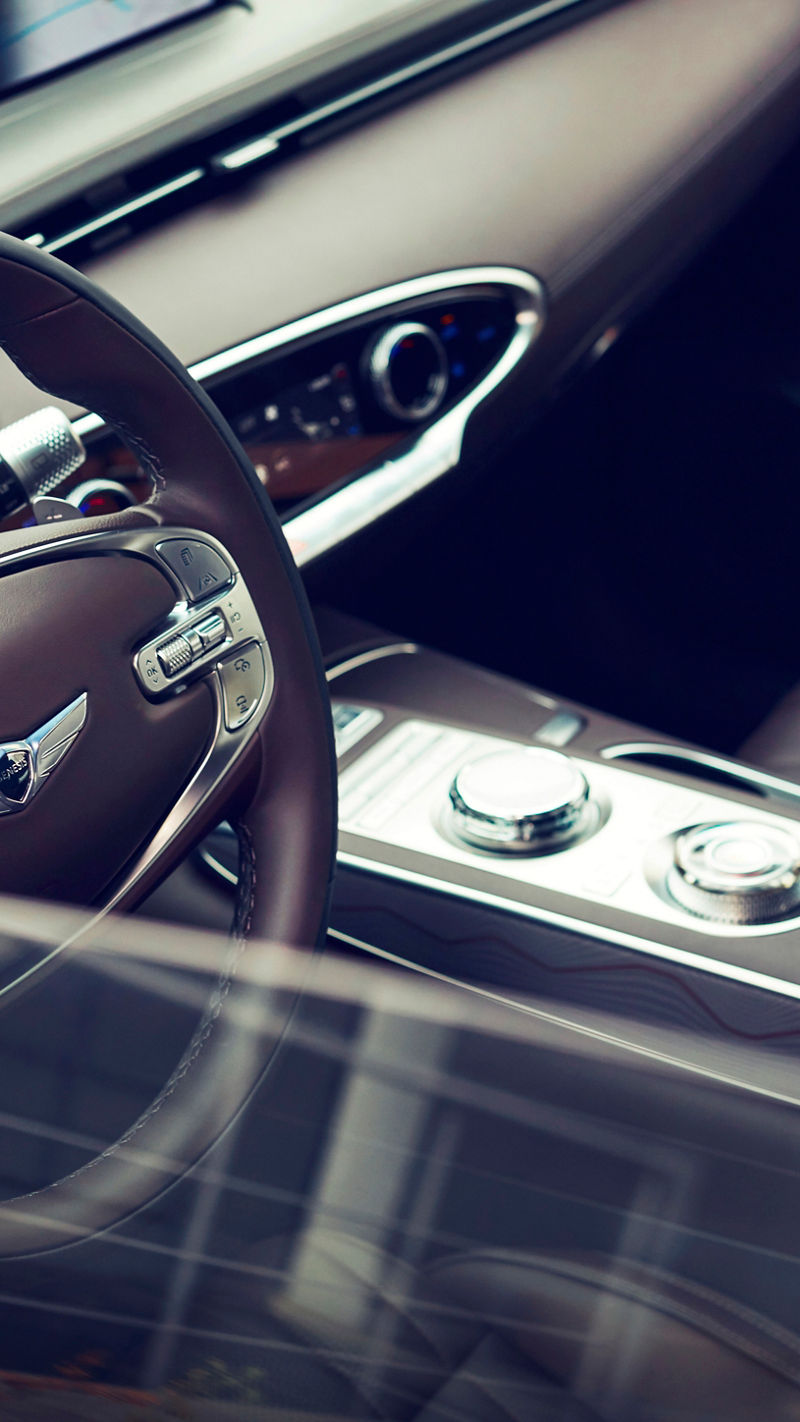 Shot of the front seats of a car through the open window on the driver's side