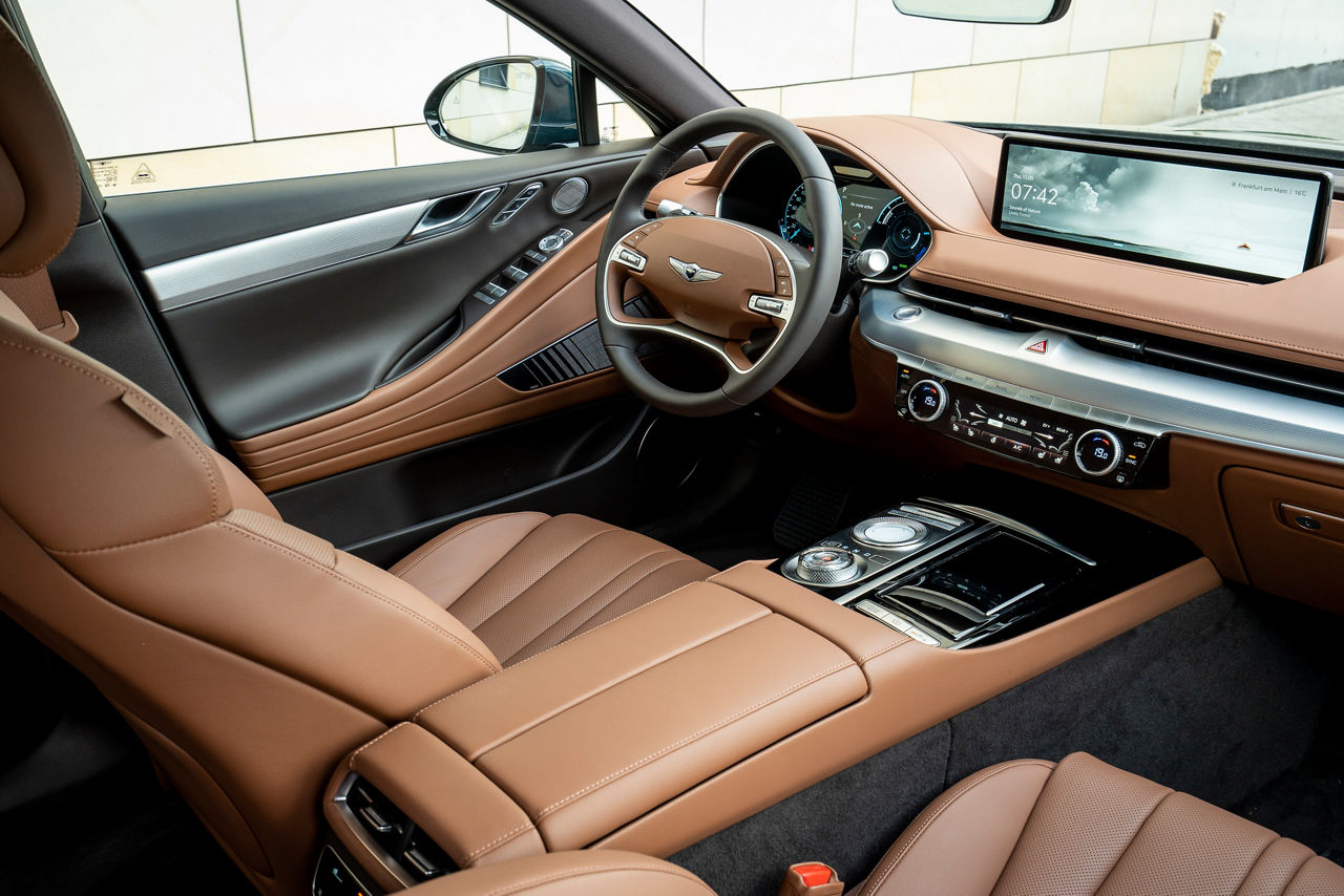 Front interior of the Genesis G80 with brown interior fittings