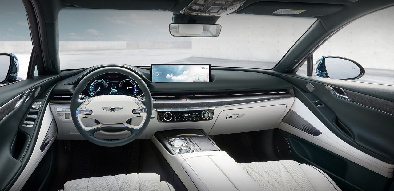 Front interior of the Genesis G80 with black and white interior design