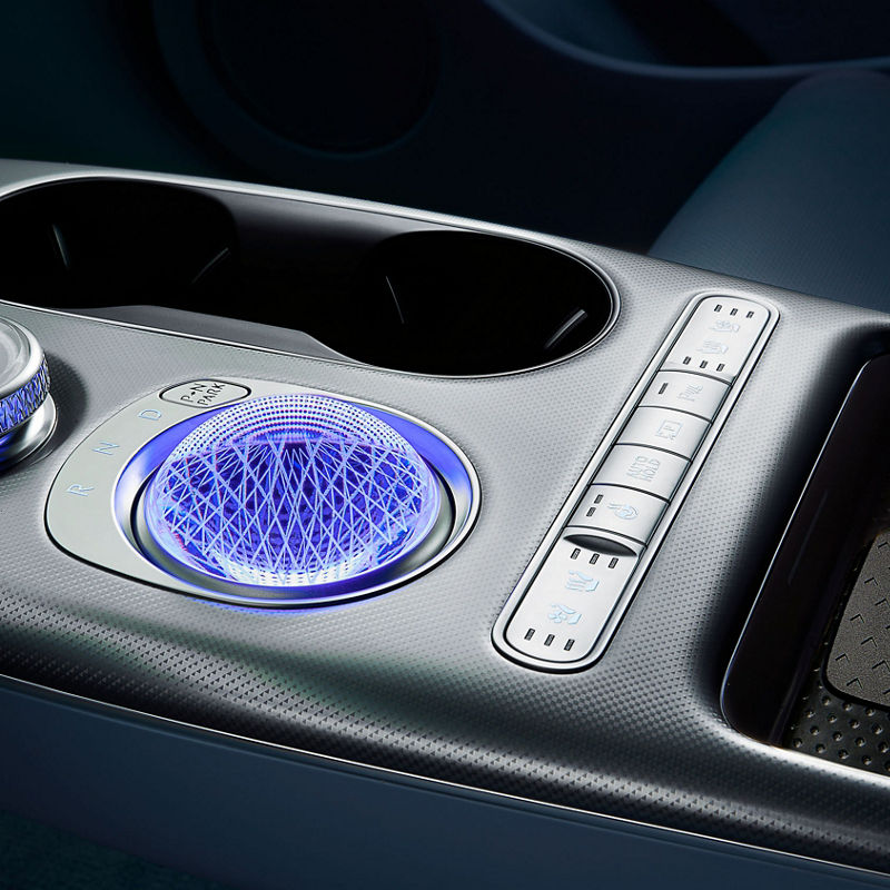 The GV60's electronic shift dial, which is subtly lit in crystal form, appears enlarged.