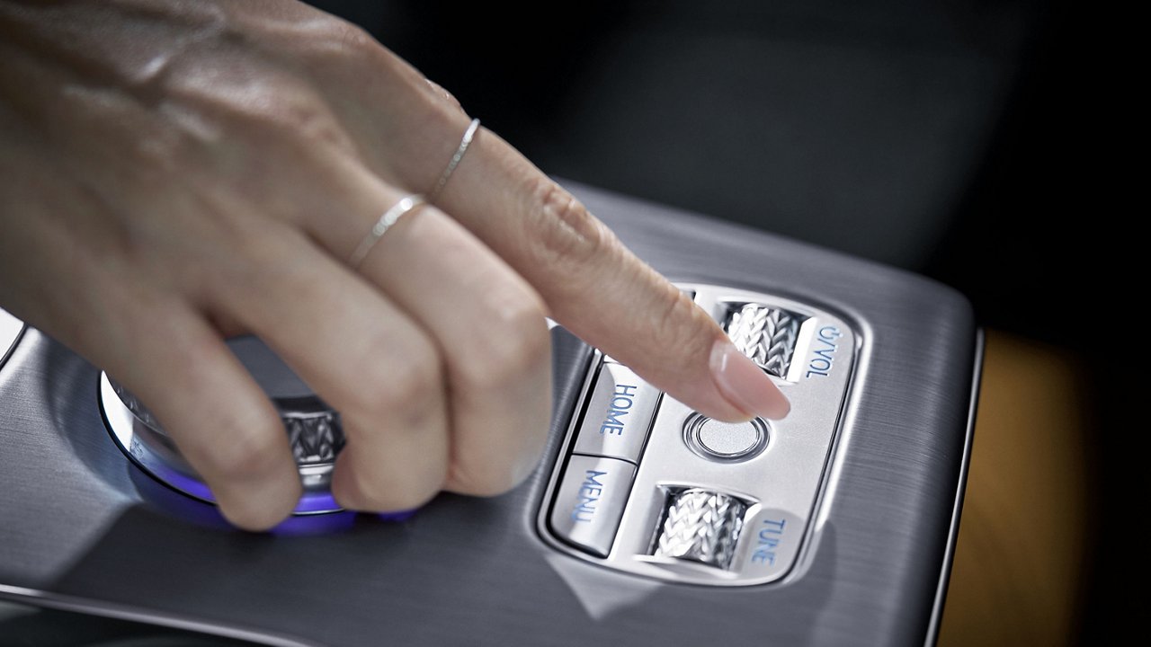 A person's finger is seen holding the index finger to the indoor fingerprint authentication system.