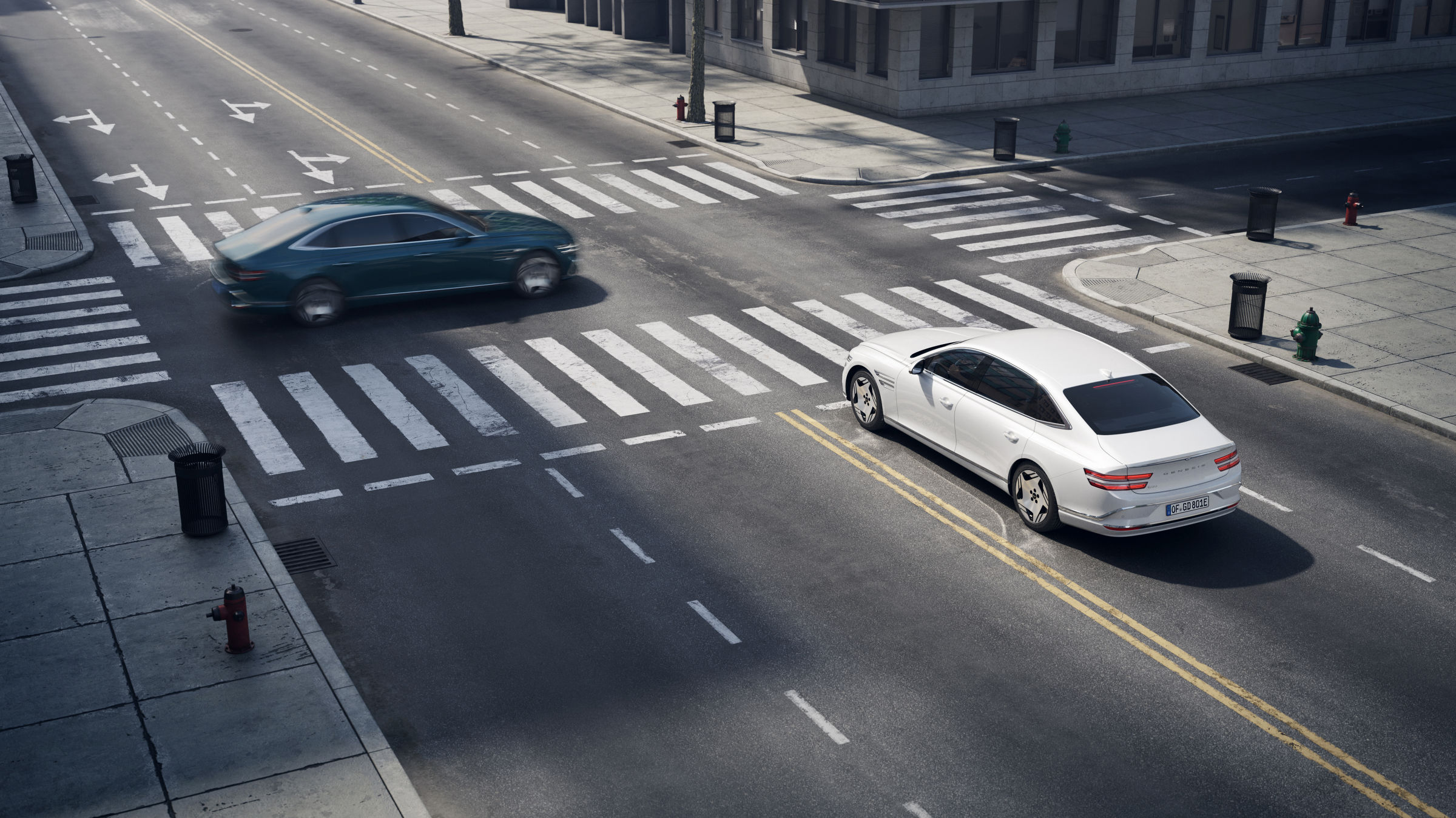 A glossy Uyuni White Electrified G80 waiting to pass through an intersection and another vehicle about to pass in front of it.