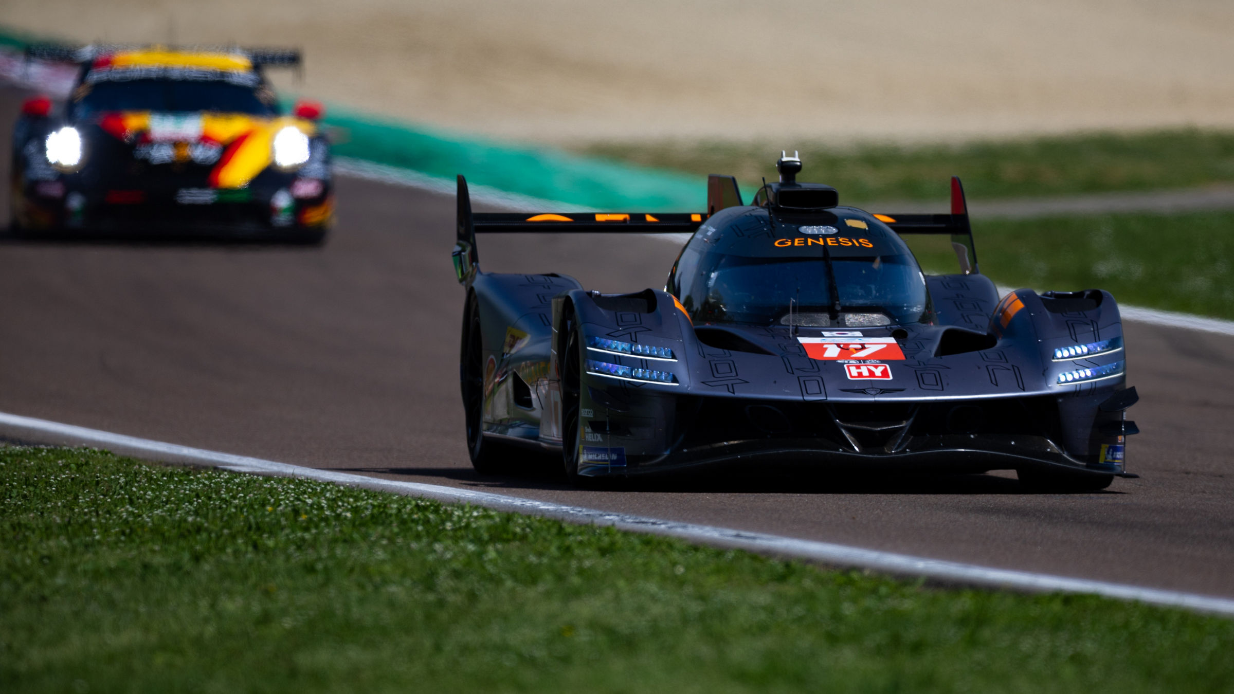 Genesis GRM-001 leading GT car on straight section at Imola.
