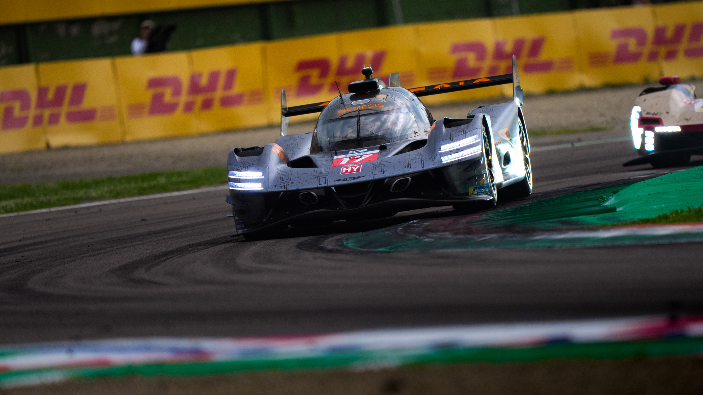 Genesis GRM-001 turning through chicane on race track at Imola.