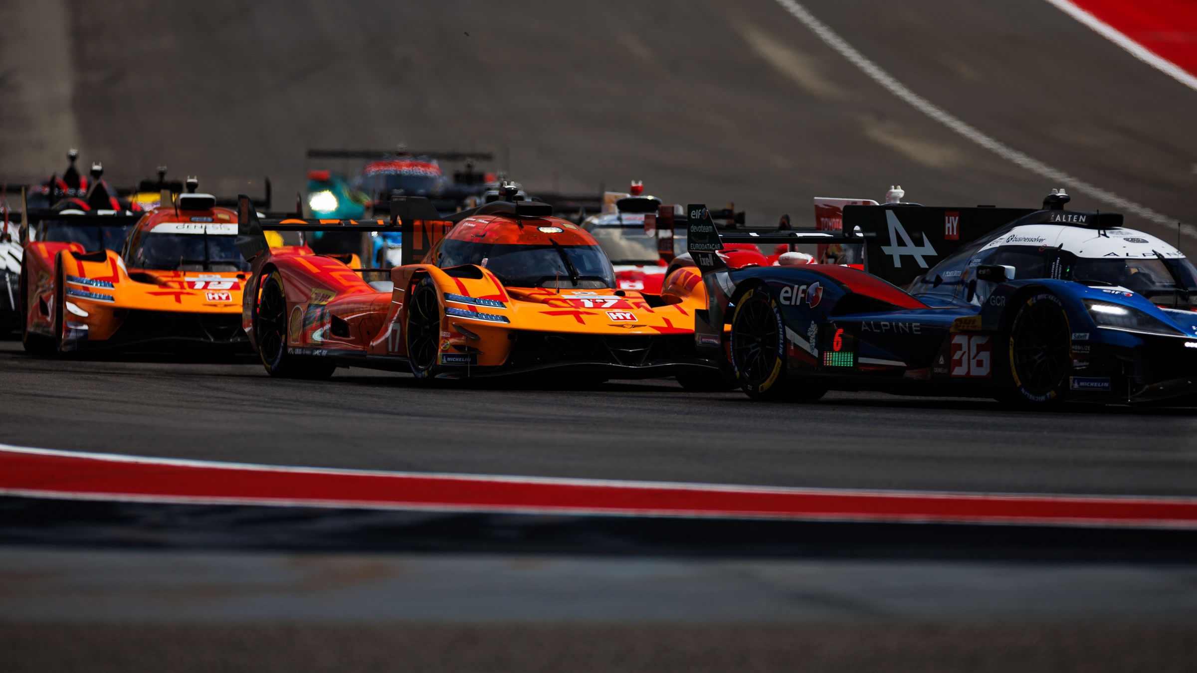 Genesis GMR-001 races in close Hypercar traffic at WEC Lone Star Le Mans in Austin.