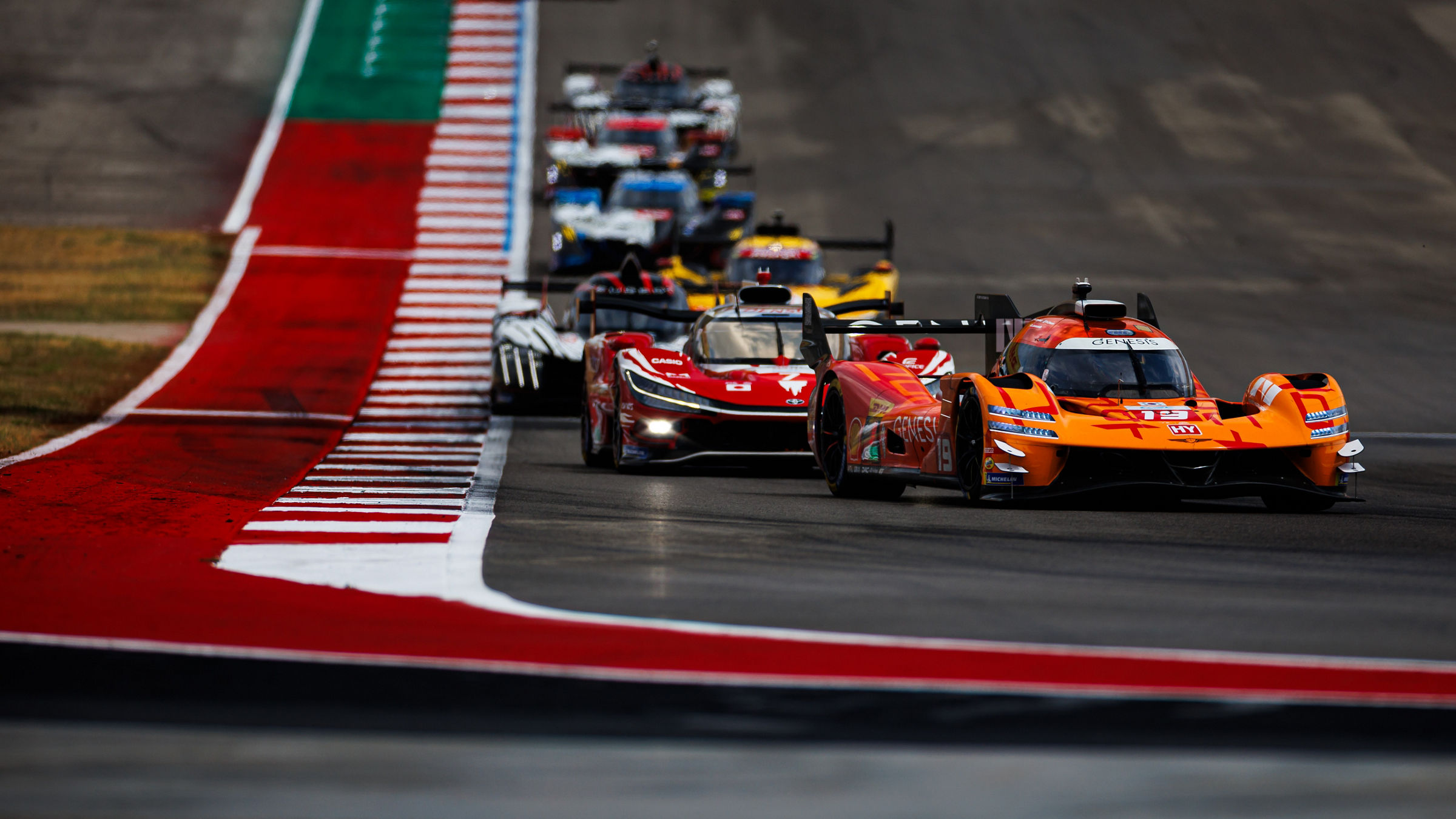 Genesis GMR-001 leads a train of Hypercars at COTA during the WEC Lone Star Le Mans.
