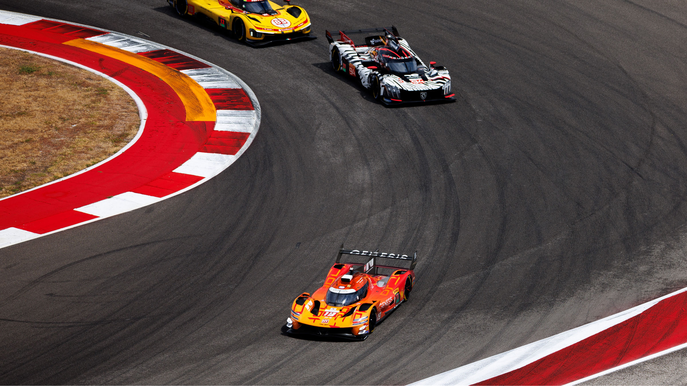 Genesis GMR-001 leads rivals through a corner at COTA during WEC Lone Star Le Mans.