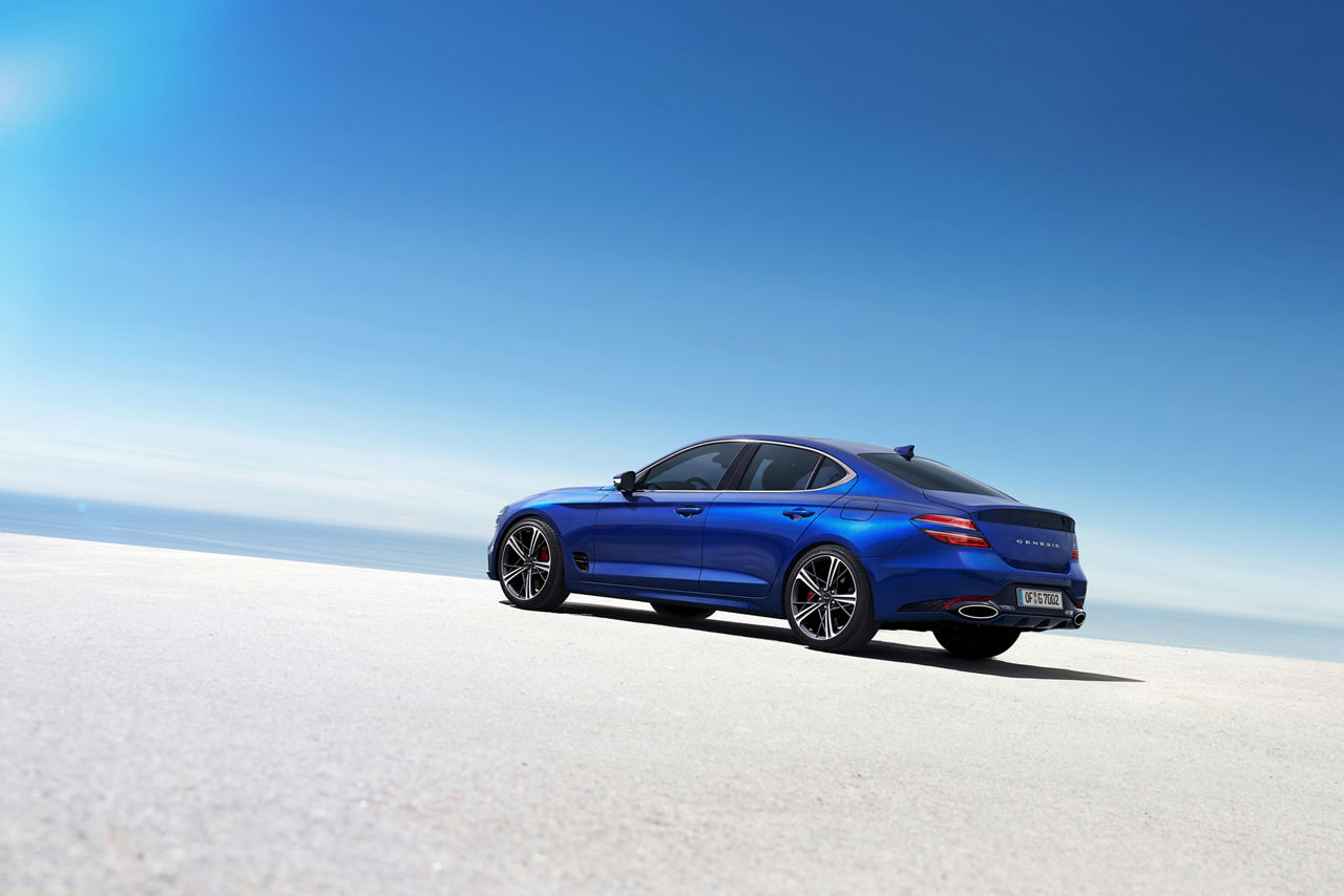 Blue Genesis G70 on the beach from the side