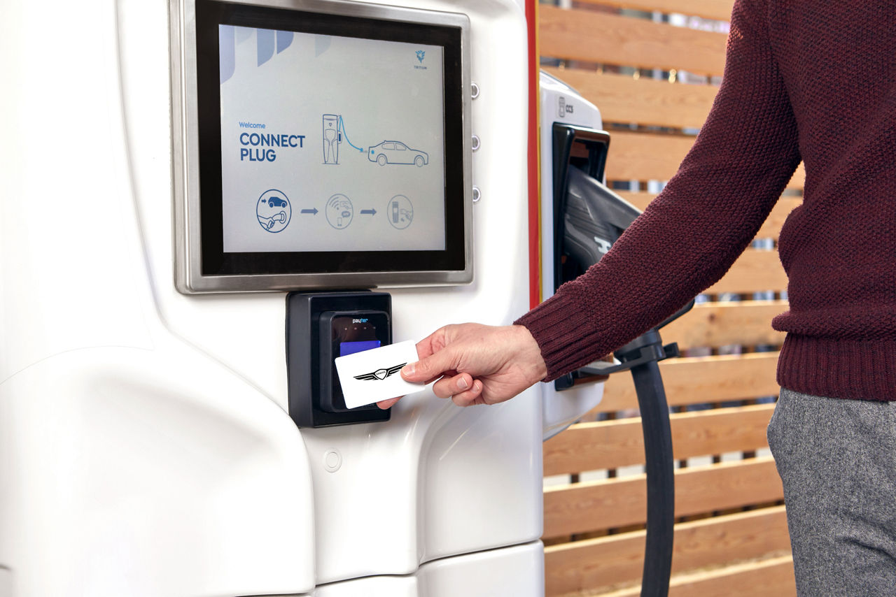 Person with card at a charging station