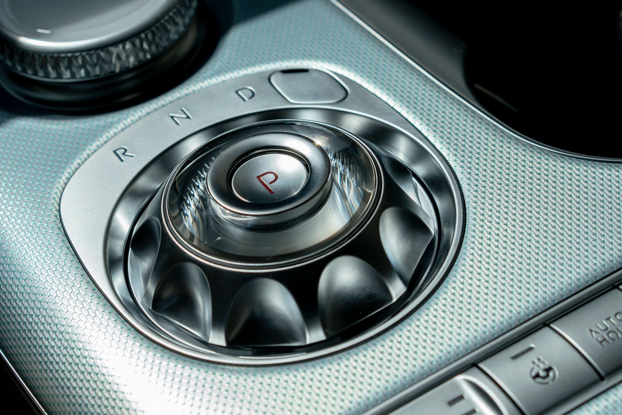 Close-up of the centre console of the Genesis GV60 in the colour Mint