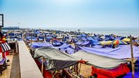 People enjoying the beauty of sea and beach by the sea shore in different ways of their own. Puri, India, Asia, February 2020.PURI A renound city,beach resort in the beach of bay of Bengal, Odisa, India.