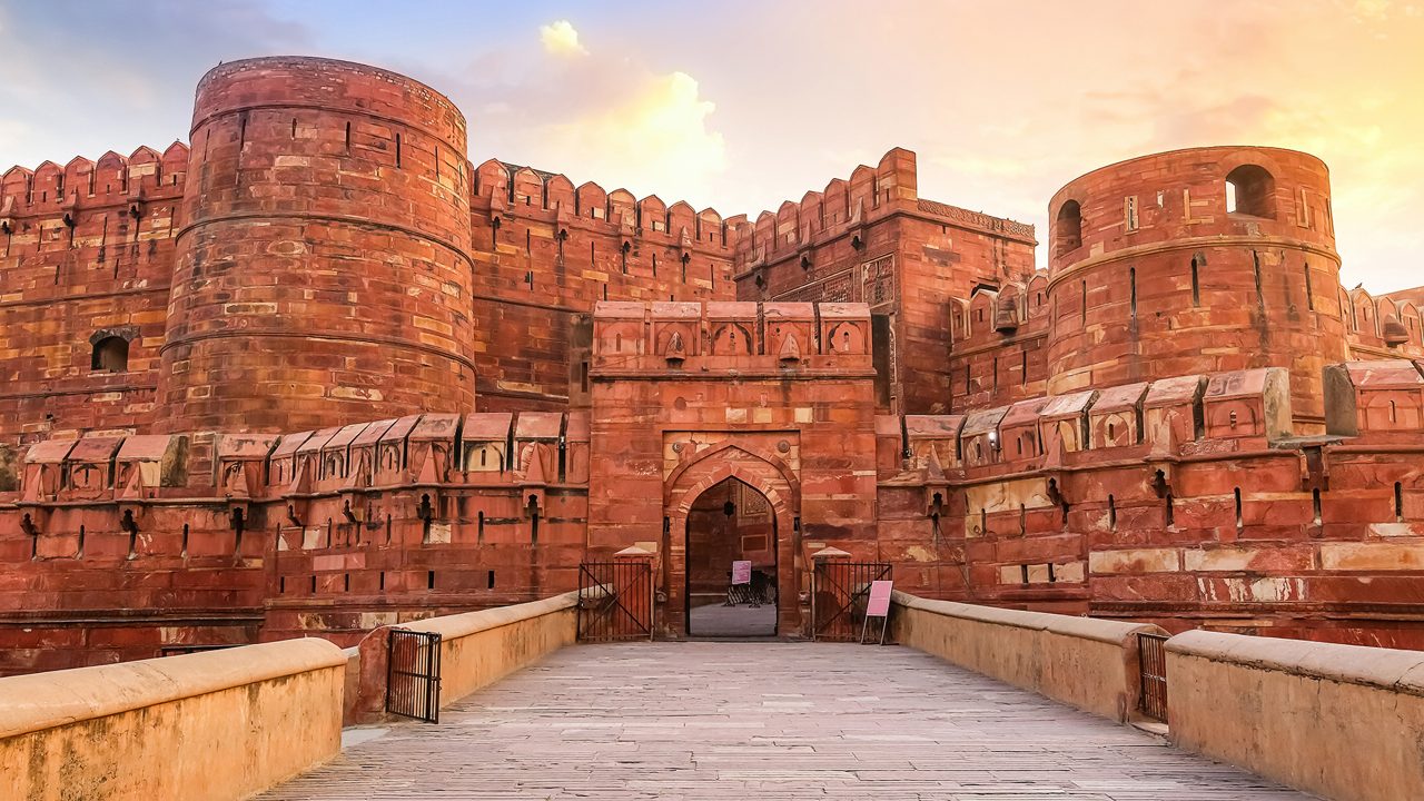 Agra Fort - Historic red sandstone fort of medieval India at sunrise. Agra Fort is a UNESCO World Heritage site in the city of Agra India.; Shutterstock ID 1418597126; purchase_order: -; job: -; client: -; other: -