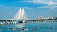 Mumbai skyline Bandra - Worli Sea Link bridge with fishing boats view from Bandra fort. Mumbai, Maharashtra, India