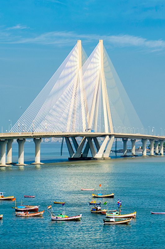 Mumbai skyline Bandra - Worli Sea Link bridge with fishing boats view from Bandra fort. Mumbai, Maharashtra, India