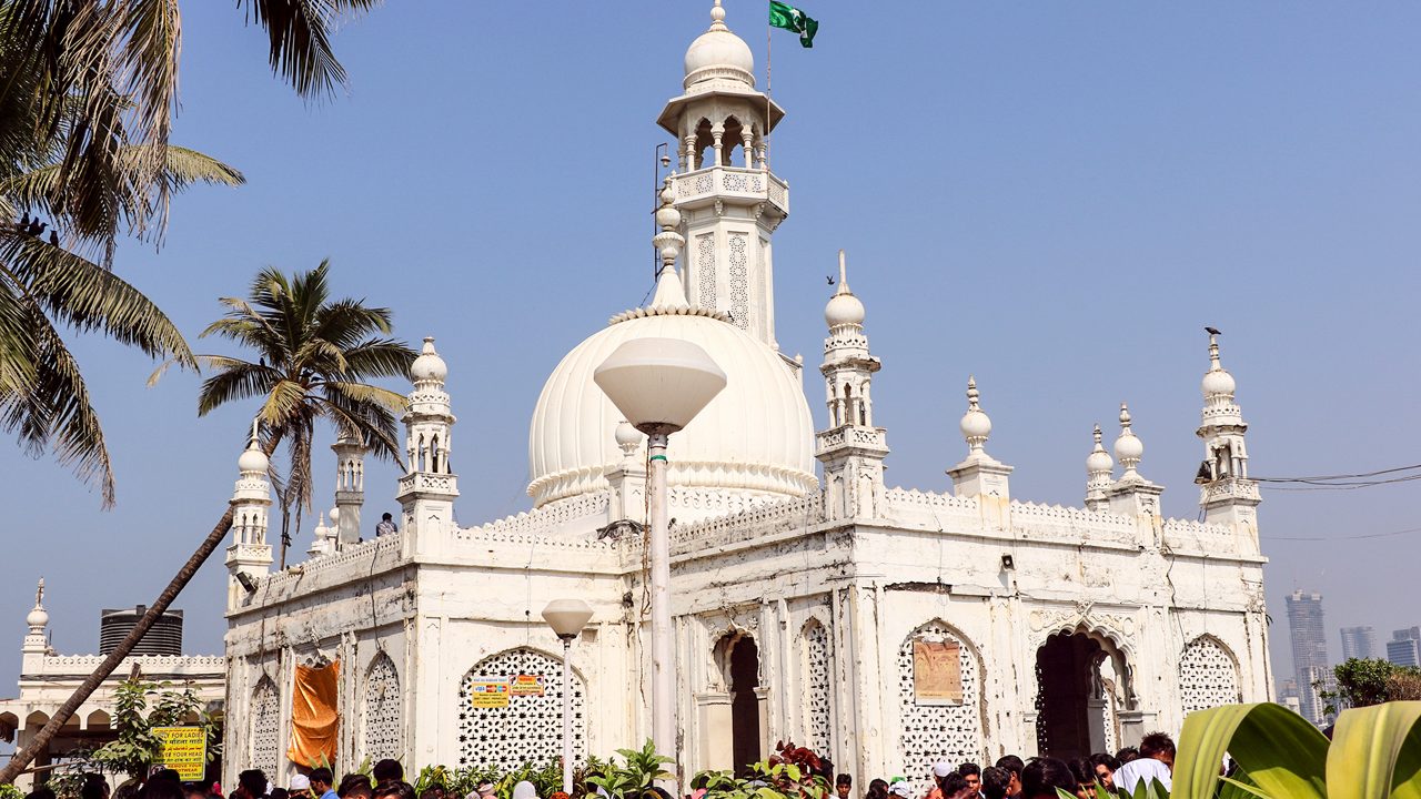 Mumbai, India - January 2, 2017: Unidentified pilgrims at Haji Ali Dargah, a historical landmark and one of the most prestigious Islamic symbols situated in South Mumbai.