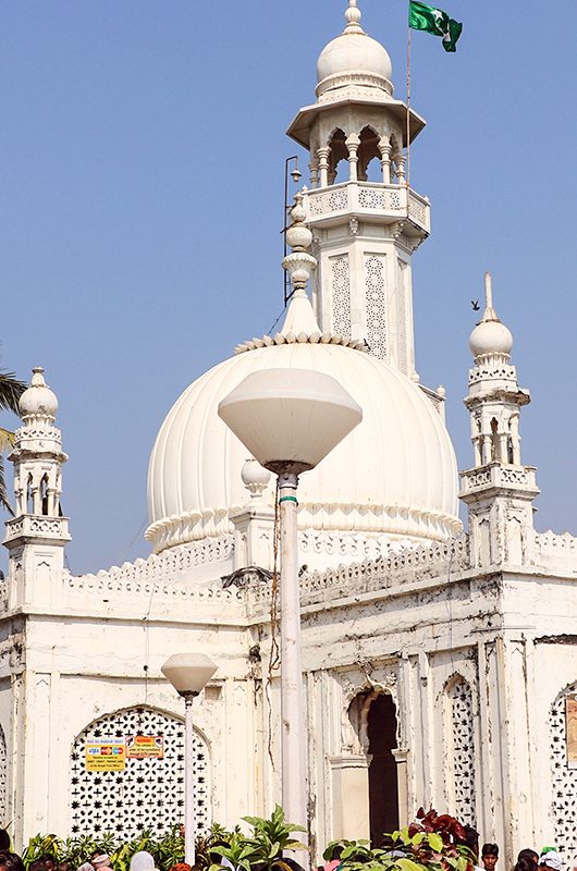 Mumbai, India - January 2, 2017: Unidentified pilgrims at Haji Ali Dargah, a historical landmark and one of the most prestigious Islamic symbols situated in South Mumbai.