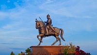 Haldighati, India, October-2018 : Silhouette of Medieval king Maharana pratap bronze statue sitting on horse Chetak depicting iconic Battle of Haldi ghati at Rajasthan, India.