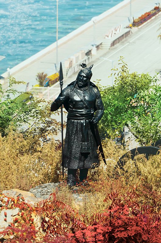 Bronze statue of Hakim Khan Suri, sur (a pathan) holding spear standing near cannon on hillock near Pratap Smarak, a memorial situated at the top of Moti Magri or Pearl Hill in Udaipur City, Rajasthan