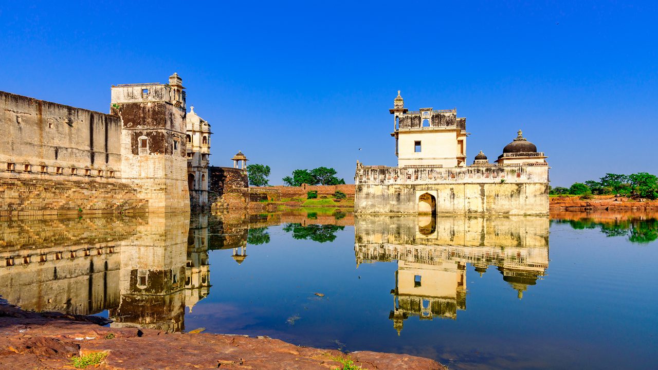 Queen Padminiâ  s Palace is one of the earliest palaces in India to be constructed completely surrounded by water. It is three storied building  built in medieval era in Rajasthani architectural style.