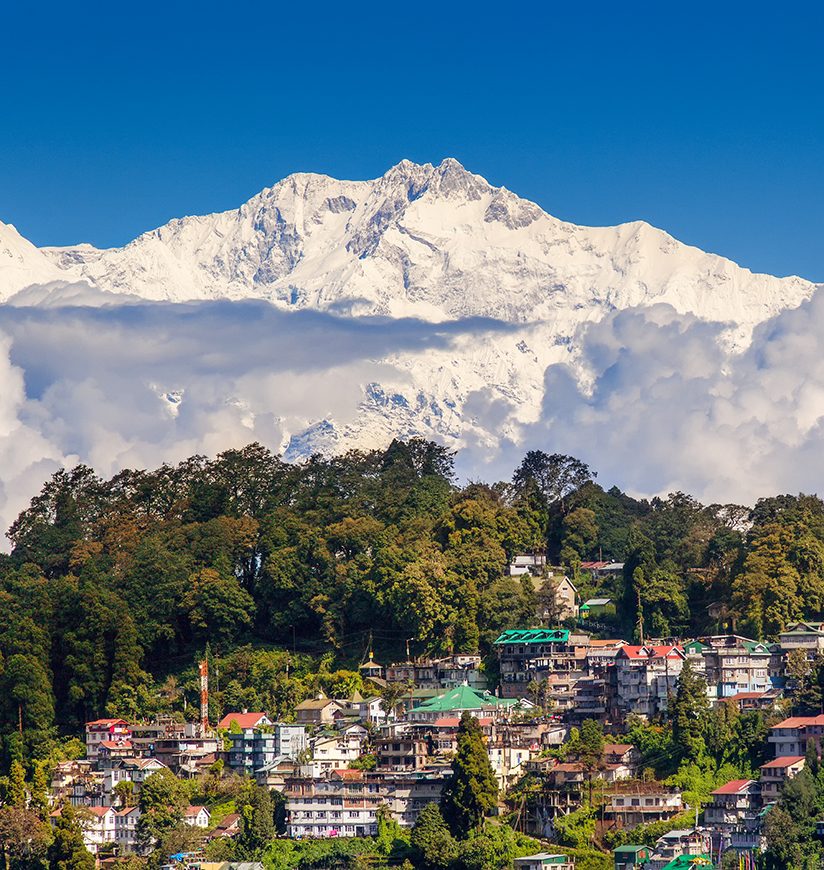 Darjeeling and Kangchenjunga on the background. Kanchenjunga, is the third highest mountain in the world. Beautiful Himalayan landscape near Nepal and Sikkim. Indian Himalayas.